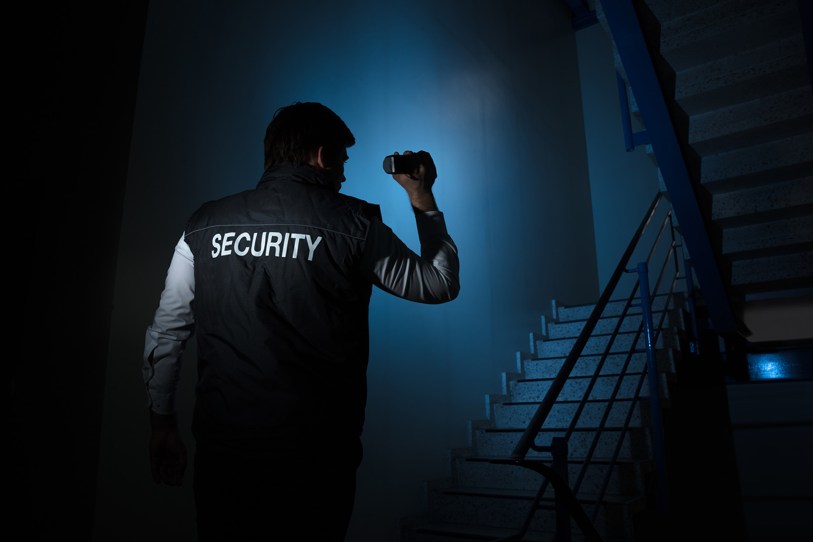Security Guard Standing Near Stairway