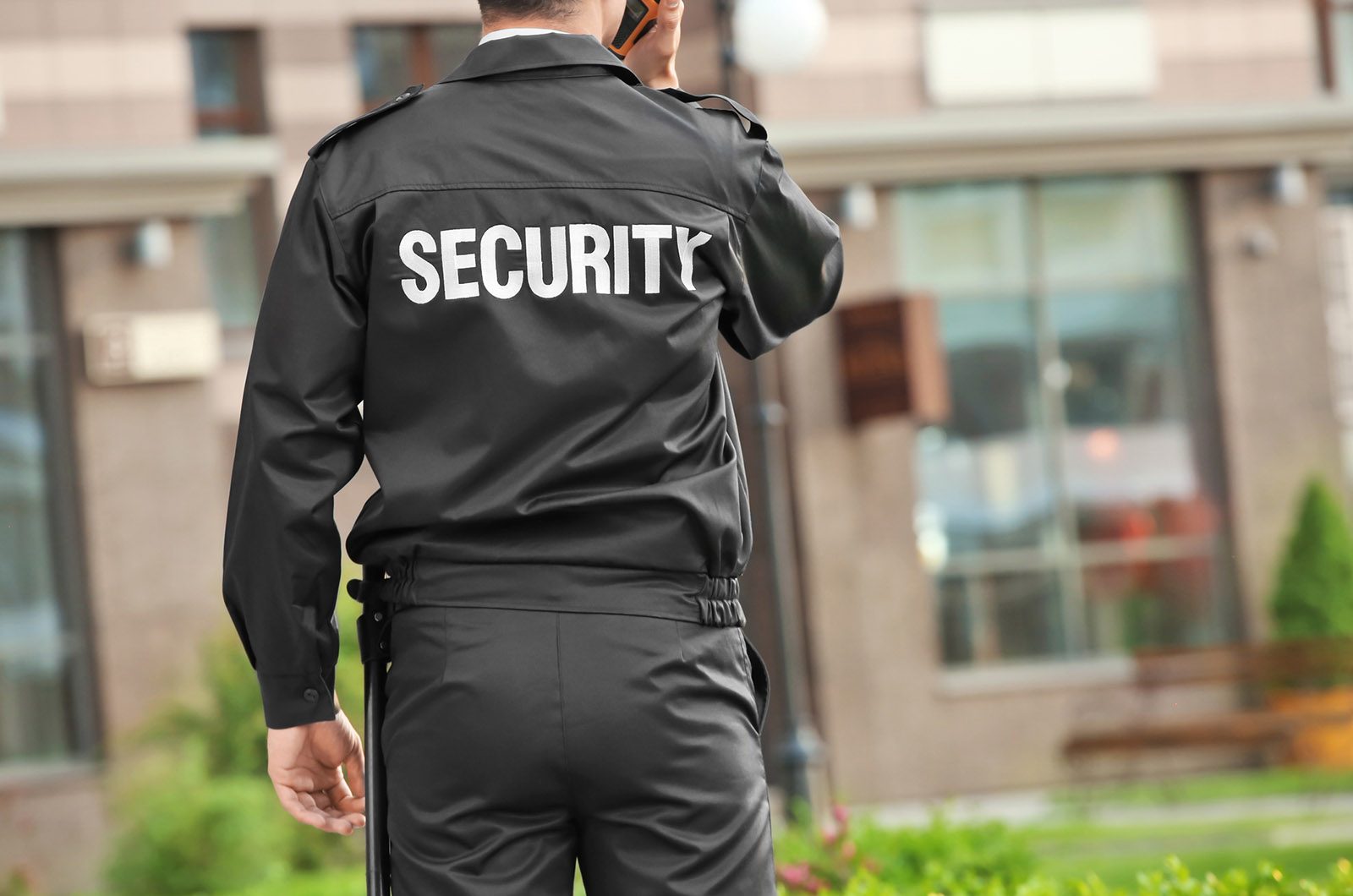 Male security guard with portable radio, outdoors | Static Guarding | 24/7 Security London
